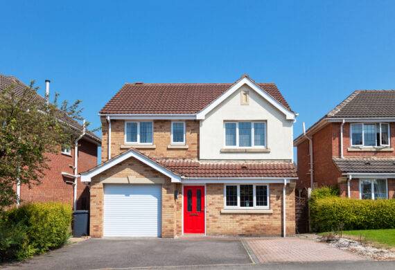 exterior shot of a house with a red door