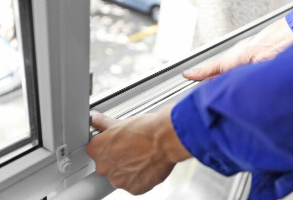 A worker installing high performing UPVC Windows