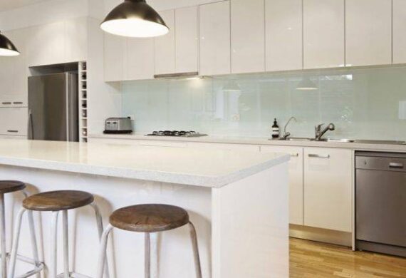 Shot of a kitchen with a table in the middle